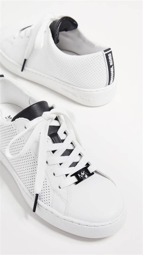 michael kors sneakers white and dark brown at the back|Michael Kors low top sneakers.